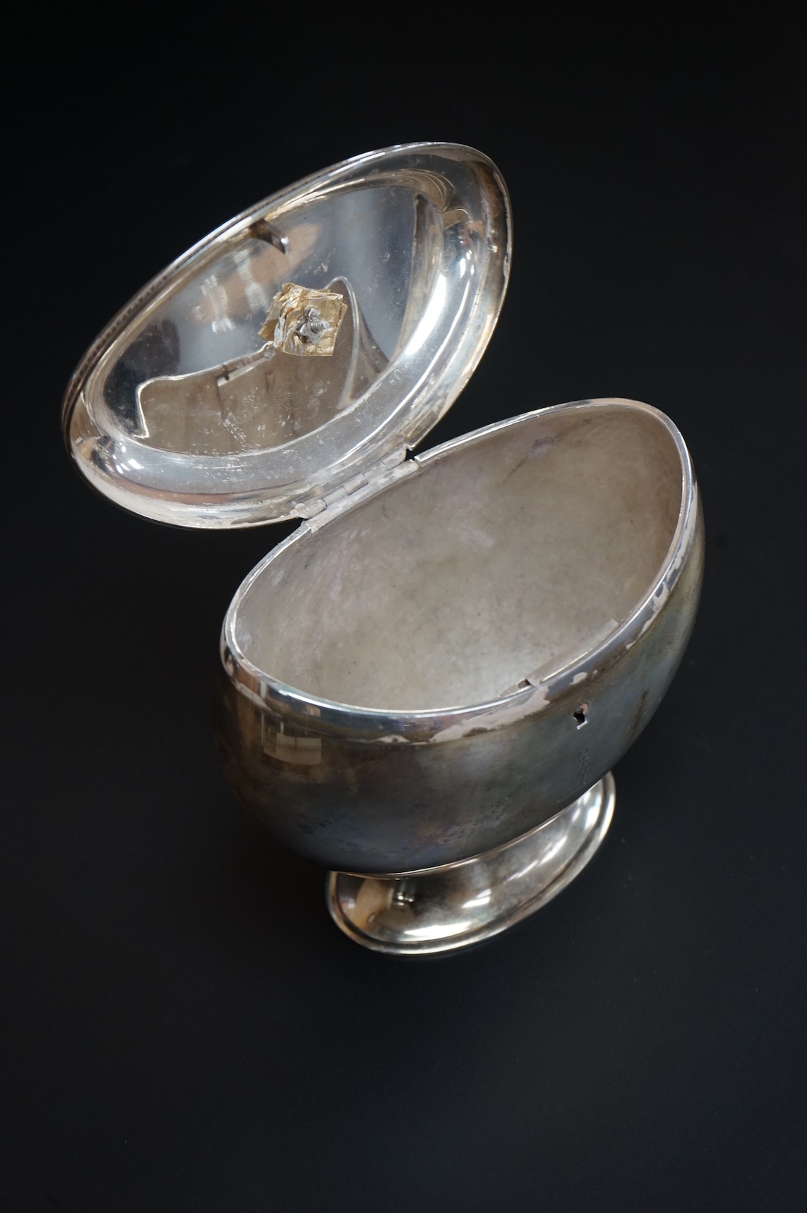 A late Victorian demi-fluted oval tea caddy, by William Hutton & Sons, London, 1894, width 11.1cm, together with a 19th century continental white metal oval tea caddy, possibly French, no key.